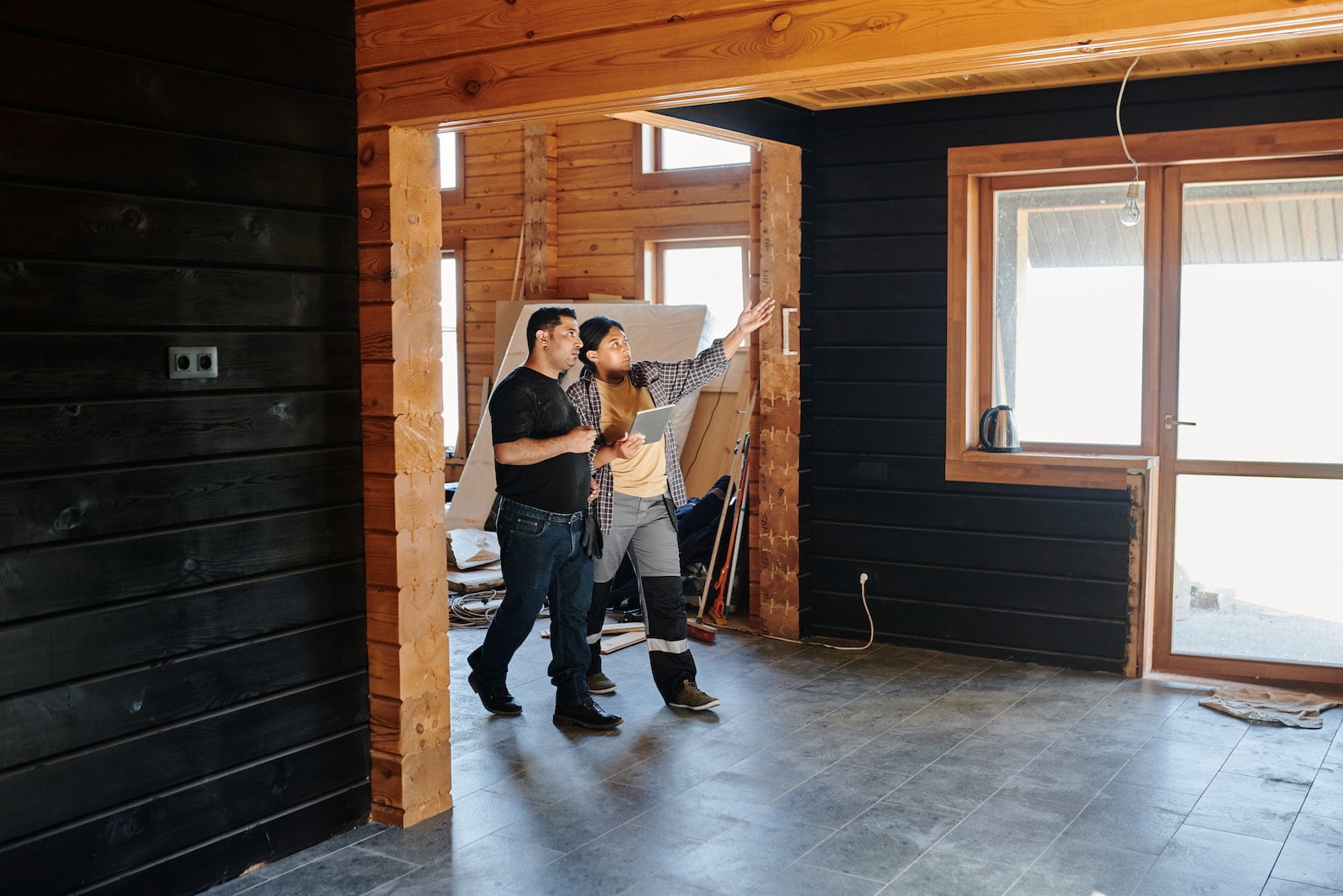 Photo by Ralphs_Fotos Two People Checking on a Construction Project
